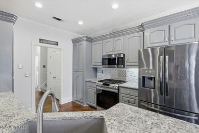 Perfectly positioned along the 10th fairway of Bay Pointe Golf on Bay Pointe Golf and Resort in Mississippi - for sale on GolfHomes.com, golf home, golf lot