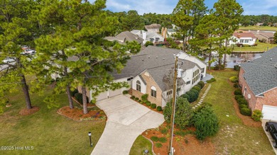 This beautifully designed home offers breathtaking water views on Harbour Point Golf Club in North Carolina - for sale on GolfHomes.com, golf home, golf lot