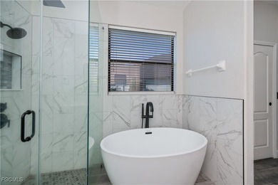 Welcome to this beautifully updated 4-bedroom, 3-bath pool home on Gateway Golf and Country Club in Florida - for sale on GolfHomes.com, golf home, golf lot