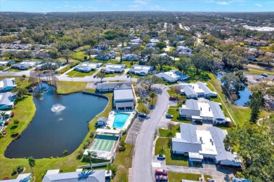 Take a peak into what resort-style living looks like in Palm on Highland Lakes Executive Golf Course in Florida - for sale on GolfHomes.com, golf home, golf lot