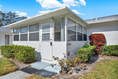 Take a peak into what resort-style living looks like in Palm on Highland Lakes Executive Golf Course in Florida - for sale on GolfHomes.com, golf home, golf lot