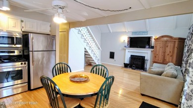 Escape to this cute-as-a-button 3-bedroom, 1-bath chalet with a on The Hideout Golf in Pennsylvania - for sale on GolfHomes.com, golf home, golf lot