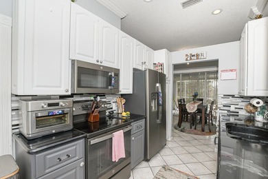 Welcome home to this beautiful 3 bedroom, 2 bath, 2 car garage on St. Lucie Trail Golf Club in Florida - for sale on GolfHomes.com, golf home, golf lot