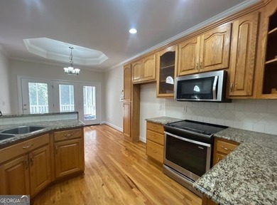 Elegant Four-Sided Brick Ranch in The Providence Club, an on The Providence Club in Georgia - for sale on GolfHomes.com, golf home, golf lot