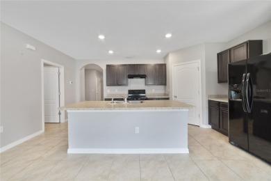 This charming 4-bedroom, 2-bathroom single-family home is on Highlands Reserve Golf Club in Florida - for sale on GolfHomes.com, golf home, golf lot