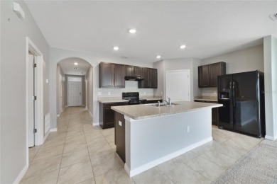 This charming 4-bedroom, 2-bathroom single-family home is on Highlands Reserve Golf Club in Florida - for sale on GolfHomes.com, golf home, golf lot