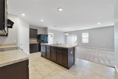 This charming 4-bedroom, 2-bathroom single-family home is on Highlands Reserve Golf Club in Florida - for sale on GolfHomes.com, golf home, golf lot