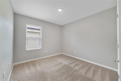 This charming 4-bedroom, 2-bathroom single-family home is on Highlands Reserve Golf Club in Florida - for sale on GolfHomes.com, golf home, golf lot