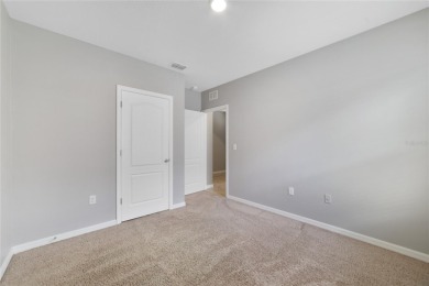 This charming 4-bedroom, 2-bathroom single-family home is on Highlands Reserve Golf Club in Florida - for sale on GolfHomes.com, golf home, golf lot