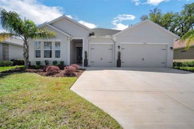 Step into luxury at this 2022 custom built home in Lake Jovita on Lake Jovita Golf and Country Club in Florida - for sale on GolfHomes.com, golf home, golf lot