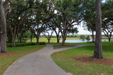Step into luxury at this 2022 custom built home in Lake Jovita on Lake Jovita Golf and Country Club in Florida - for sale on GolfHomes.com, golf home, golf lot