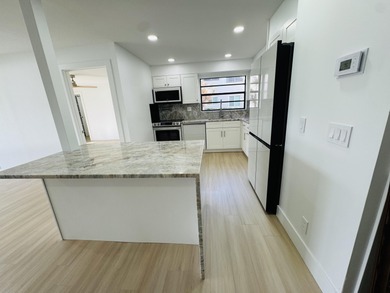 A very rare opportunity to own a first floor waterfront Isle of on Kings Point Golf -Flanders Way in Florida - for sale on GolfHomes.com, golf home, golf lot