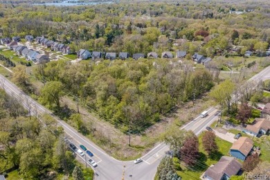 Vacant land zoned for residential on the corner of Wise and on Union Lake Golf Course in Michigan - for sale on GolfHomes.com, golf home, golf lot