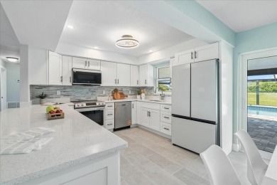 Fully remodeled home with golf and water views in the on Rotonda Golf and Country Club The Hills Course in Florida - for sale on GolfHomes.com, golf home, golf lot
