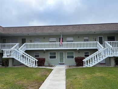 Step inside this condo and appreciate the bright, open floor on Tarpon Springs Golf Course in Florida - for sale on GolfHomes.com, golf home, golf lot
