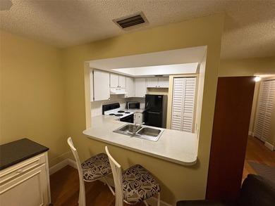 Step inside this condo and appreciate the bright, open floor on Tarpon Springs Golf Course in Florida - for sale on GolfHomes.com, golf home, golf lot