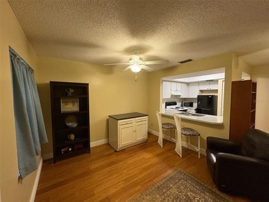 Step inside this condo and appreciate the bright, open floor on Tarpon Springs Golf Course in Florida - for sale on GolfHomes.com, golf home, golf lot