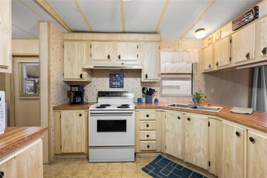 Are you looking for a cozy Florida retreat to escape the cold on Betmar Acres Golf Club in Florida - for sale on GolfHomes.com, golf home, golf lot