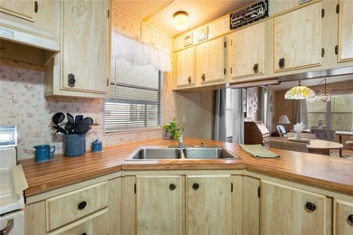 Are you looking for a cozy Florida retreat to escape the cold on Betmar Acres Golf Club in Florida - for sale on GolfHomes.com, golf home, golf lot