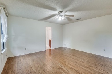 New flooring in living room, kitchen 2 bedrooms and 2 bathrooms on Texas Rangers Golf Club  in Texas - for sale on GolfHomes.com, golf home, golf lot