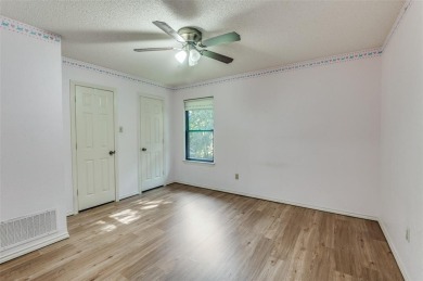 New flooring in living room, kitchen 2 bedrooms and 2 bathrooms on Texas Rangers Golf Club  in Texas - for sale on GolfHomes.com, golf home, golf lot
