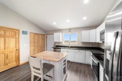 This charming 3-bed, 2-bath ranch offers modern finishes, a on Hollydot Golf Course in Colorado - for sale on GolfHomes.com, golf home, golf lot