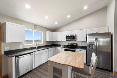 This charming 3-bed, 2-bath ranch offers modern finishes, a on Hollydot Golf Course in Colorado - for sale on GolfHomes.com, golf home, golf lot