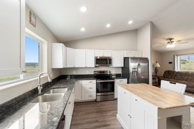 This charming 3-bed, 2-bath ranch offers modern finishes, a on Hollydot Golf Course in Colorado - for sale on GolfHomes.com, golf home, golf lot