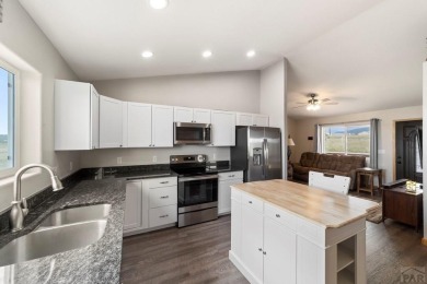 This charming 3-bed, 2-bath ranch offers modern finishes, a on Hollydot Golf Course in Colorado - for sale on GolfHomes.com, golf home, golf lot