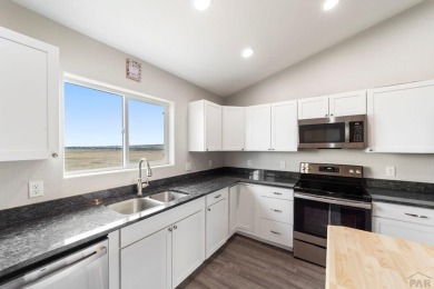 This charming 3-bed, 2-bath ranch offers modern finishes, a on Hollydot Golf Course in Colorado - for sale on GolfHomes.com, golf home, golf lot