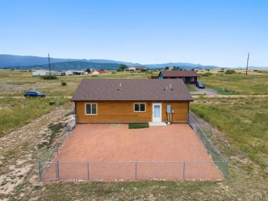 This charming 3-bed, 2-bath ranch offers modern finishes, a on Hollydot Golf Course in Colorado - for sale on GolfHomes.com, golf home, golf lot