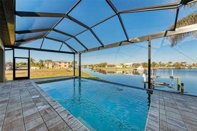 Fall in love with this 2015 built custom waterfront pool home on Saint Andrews South Golf Club in Florida - for sale on GolfHomes.com, golf home, golf lot