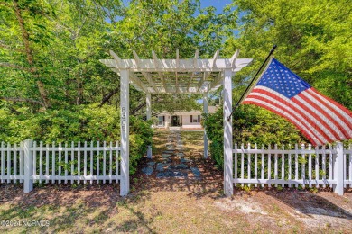 This coastal cottage is located on the prestigious Bald Eagle on Porters Neck Country Club in North Carolina - for sale on GolfHomes.com, golf home, golf lot