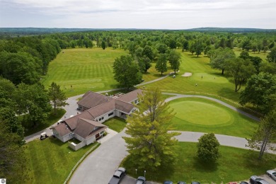 Discover 1.7 acres of beautifully wooded land, conveniently on Lakes of the North Deer Run Golf Course in Michigan - for sale on GolfHomes.com, golf home, golf lot