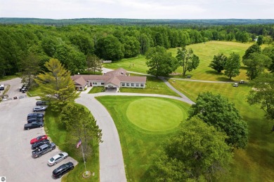 Discover 1.7 acres of beautifully wooded land, conveniently on Lakes of the North Deer Run Golf Course in Michigan - for sale on GolfHomes.com, golf home, golf lot