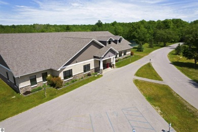 Discover 1.7 acres of beautifully wooded land, conveniently on Lakes of the North Deer Run Golf Course in Michigan - for sale on GolfHomes.com, golf home, golf lot