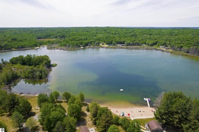 Discover 1.7 acres of beautifully wooded land, conveniently on Lakes of the North Deer Run Golf Course in Michigan - for sale on GolfHomes.com, golf home, golf lot