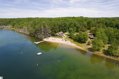 Discover 1.7 acres of beautifully wooded land, conveniently on Lakes of the North Deer Run Golf Course in Michigan - for sale on GolfHomes.com, golf home, golf lot