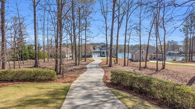 Elegant Waterfront Living in Plantation Community! Nestled on The Patriot Golf Club At Grand Harbor in South Carolina - for sale on GolfHomes.com, golf home, golf lot