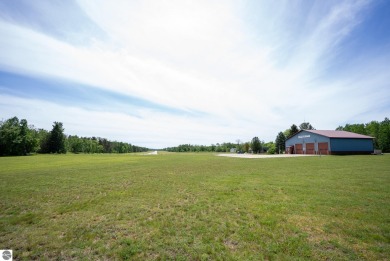 Discover 1.7 acres of beautifully wooded land, conveniently on Lakes of the North Deer Run Golf Course in Michigan - for sale on GolfHomes.com, golf home, golf lot