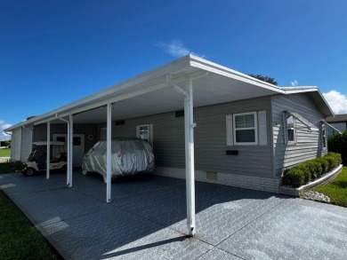 This well maintained 2 bedroom2 bath, 1988 Homes of Merit sits on Lake Henry Golf Club in Florida - for sale on GolfHomes.com, golf home, golf lot