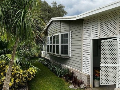 This well maintained 2 bedroom2 bath, 1988 Homes of Merit sits on Lake Henry Golf Club in Florida - for sale on GolfHomes.com, golf home, golf lot