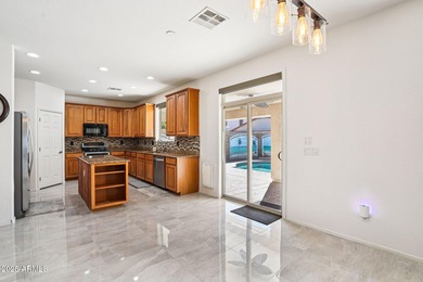 Welcome to your dream home! This stunning 5-bedroom, 3-bath on The Golf Club At Johnson Ranch in Arizona - for sale on GolfHomes.com, golf home, golf lot