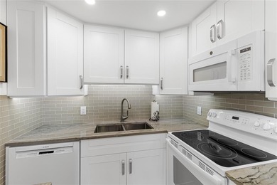 BEAUTIFULLY REMODELED, FIRST FLOOR 2 BEDROOM, 1.5 BATH CONDO on Hillsboro Pines Golf in Florida - for sale on GolfHomes.com, golf home, golf lot