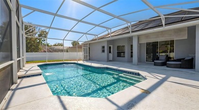 Welcome to this lovely pool home on an oversized lot with a huge on Ridgewood Lakes Golf and Country Club in Florida - for sale on GolfHomes.com, golf home, golf lot