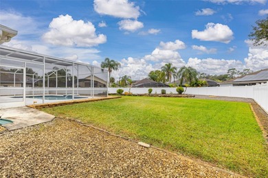 Welcome to this lovely pool home on an oversized lot with a huge on Ridgewood Lakes Golf and Country Club in Florida - for sale on GolfHomes.com, golf home, golf lot