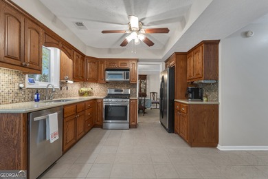 Tucked away on a quiet cul-de-sac, this beautiful 4-bedroom, 2 on Braelinn Golf Club in Georgia - for sale on GolfHomes.com, golf home, golf lot