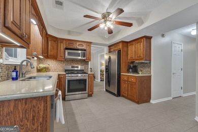 Tucked away on a quiet cul-de-sac, this beautiful 4-bedroom, 2 on Braelinn Golf Club in Georgia - for sale on GolfHomes.com, golf home, golf lot