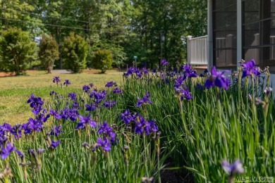 Enjoy main lake views and water-access living from this cape cod on Tanglewood Shores Golf Club in Virginia - for sale on GolfHomes.com, golf home, golf lot