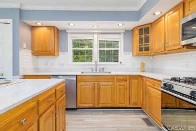 Enjoy main lake views and water-access living from this cape cod on Tanglewood Shores Golf Club in Virginia - for sale on GolfHomes.com, golf home, golf lot